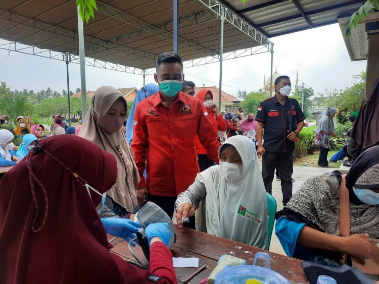 Vaksinasi BAGUNA DPC PDI Perjuangan Kabupaten Lampung Selatan  Di Desa Karang Sari Kecamatan Jatia Aung Kabupaten Lampung Selatan